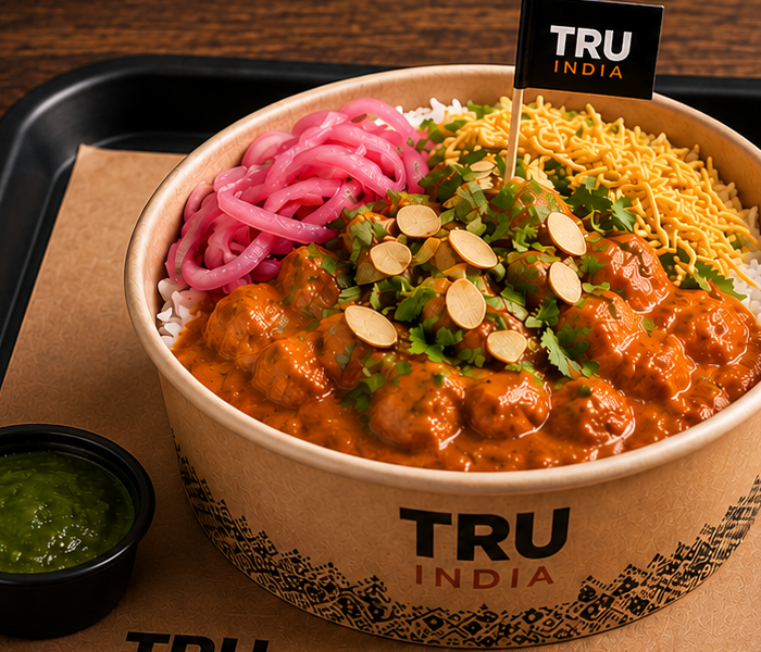 TRU INDIA Royal Makhani served with rice, pickled onions and crunch